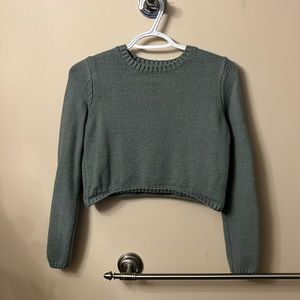 Good condition. Medium cropped sage green knit sweater from Garage.